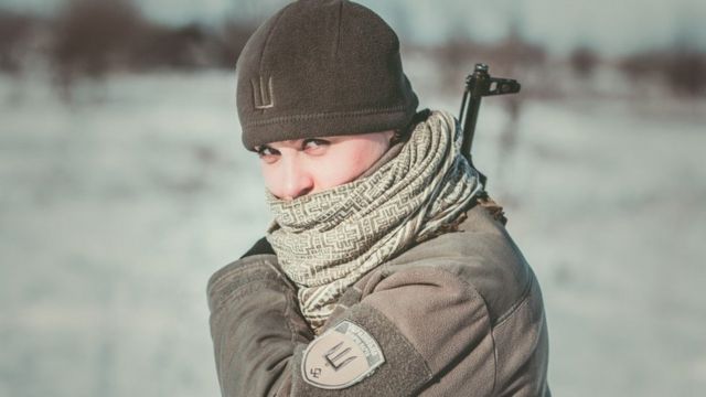 Olena Biletskyi holds a gun