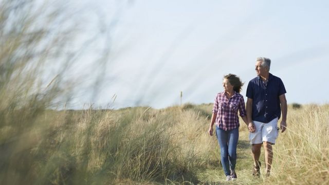 A couple in a beach walk