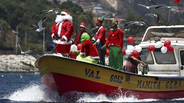 Fishermen as Santa and Grinch Valparaiso Bay Chile
