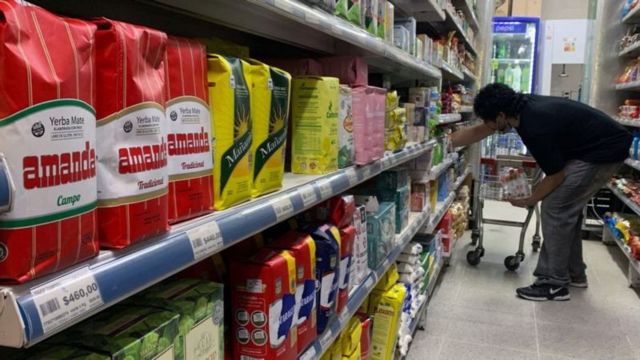 A man in a supermarket shelf