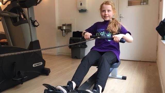 Image of Luna on a rowing machine. 