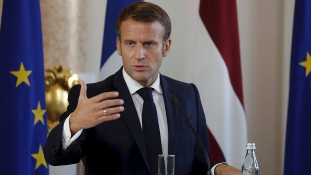 Emmanuel Macron giving a presser
