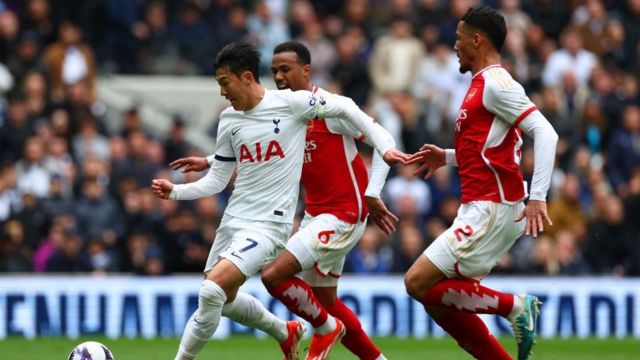 Arsenal defenders William Saliba and Gabriel challenge Tottenham's Son Heung-min