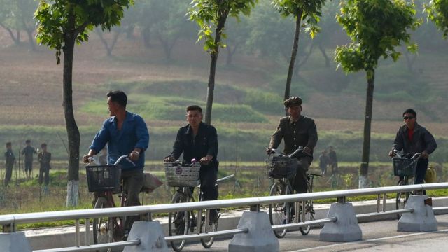 Workers on bicycles