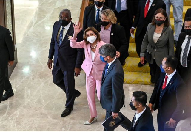 Pelosi waves to the media after meeting with Malaysian Parliament Speaker Azhar Azizan Harun at the Parliament House in Kuala Lumpur, Malaysia, on August 2.