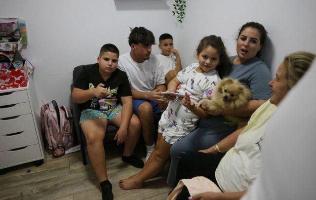 An Israeli family take shelter in a basement in the southern city of Ashkelon 