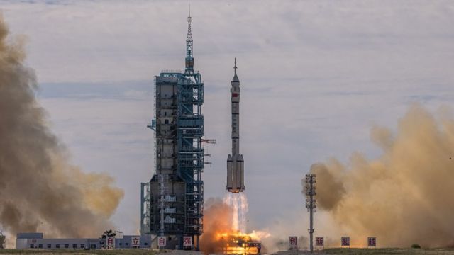 China launches Shenzhou-12 spacecraft: epa09278499 The Long March-2F carrier rocket, carrying the Shenzhou-12, takes off from the launch site at the Jiuquan Satellite Launch Center, in the Gobi Desert, Inner Mongolia, near Jiuquan, China, 17 June 2021.