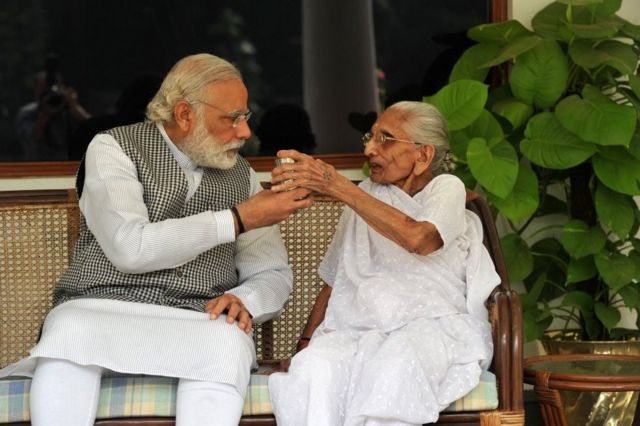 Prime Minister Narendra Modi with his mother Hiraba at the 7RCR in New Delhi during the latter's first visit to the PM's residence.