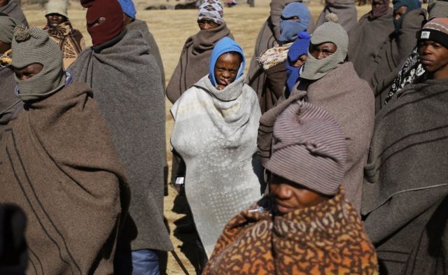 Basotho tribesmen wearing the traditional Basotho tribal blanket (Seanamarena) to stay warm in the bitterly cold mountain air in Semonkong, Lesotho, 15 July 2017 (issued 17 July 2017).