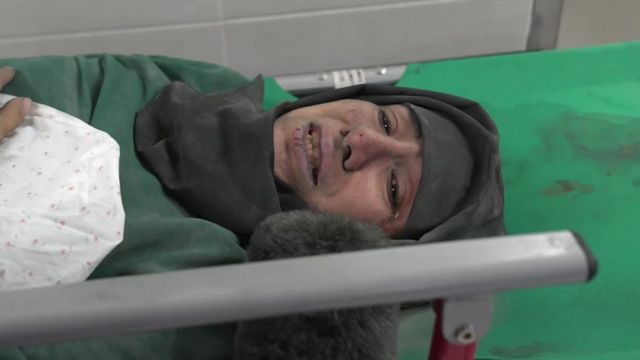 Woman on a stretcher at al-Shifa hospital