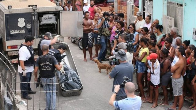 Police officers carry a body during a military police strike in Vitoria, Espirito Santo, Brazil February 10, 2017.