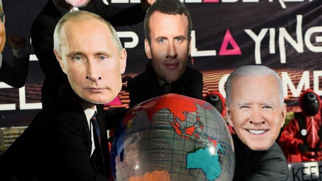Маски Путина, Макрона и Байдена