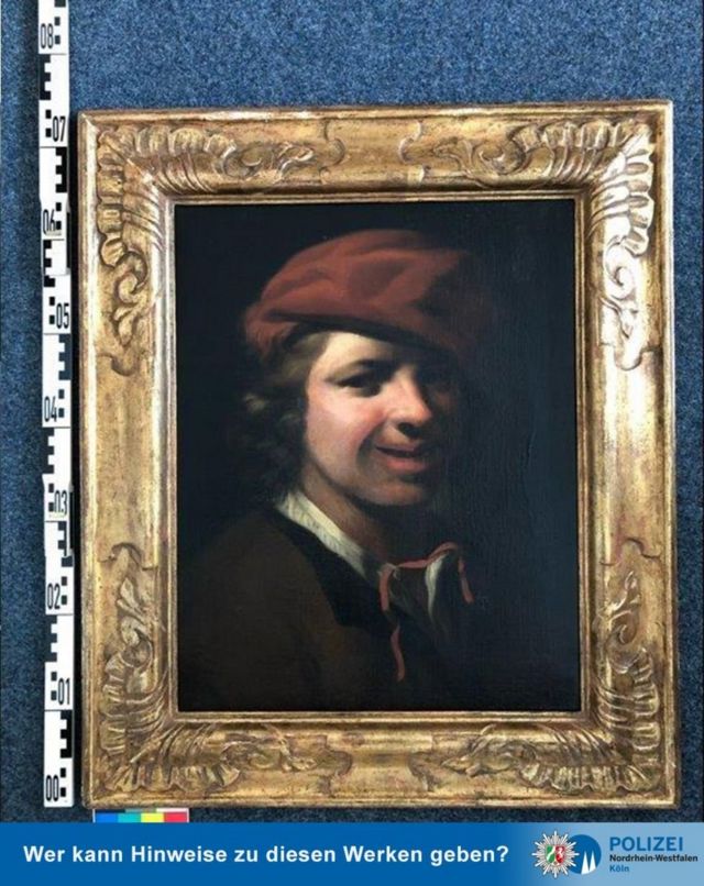 لوحة لصبي يرتدي قبعة حمراء