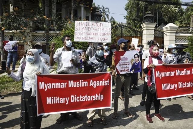 Muslim demonstrators hold placards during a protest against the Myanmar military coup, outside the Embassy of Thailand in Yangon, Myanmar, 24 February 2021.