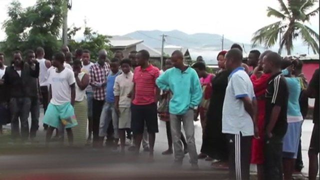Burundian villagers gathered in mourning