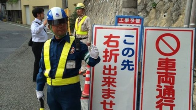 Human traffic light officer in Japan