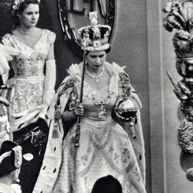 Queen Elizabeth holds the royal scepter with the 'Star of Africa' diamond on it at her coronation.