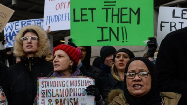 Protesters rally during a protest against the Muslim immigration ban at John F. Kennedy International Airport on January 28, 2017 in New York City