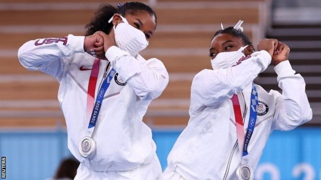 Jordan Chiles and Simone Biles celebrate USA's silver medal in the women's team final at Tokyo 2020