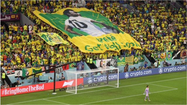 Brazil fans hold a banner showing support for former Brazil player Pele during the FIFA World Cup Qatar 2022 Round of 16 match between Brazil and South Korea at Stadium 974 on December 05, 2022 in Doha, Qatar.