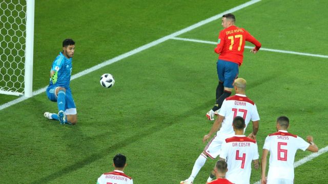Iago Aspas of Spain back heels in past Monir El Kajoui of Morocco to score his sides second goal during the 2018 FIFA World Cup Russia group B match between Spain and Morocco at Kaliningrad Stadium on June 25, 2018 in Kaliningrad, Russia.
