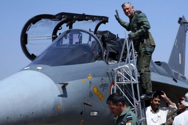 Chief of The Indian Army Bipin Rawat gestures before he sits inside the cockpit of Indian Air Force (IAF) Tejas fighter jet during the second day of the 12th edition of the Aero India 2019 at the Yelahanka Air Force Station in Bangalore, India, 21 February 2019