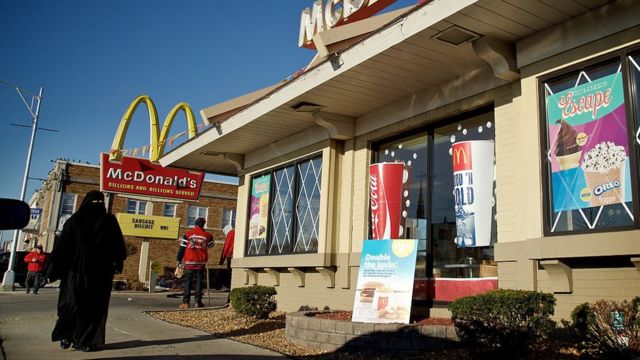 A woman walks past a McDonald's in Hamtramck, Michigan.