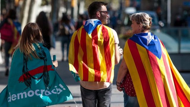 Protesters gather in the city center to demonstrate against the Spanish federal government;s move to suspend Catalonian autonomy