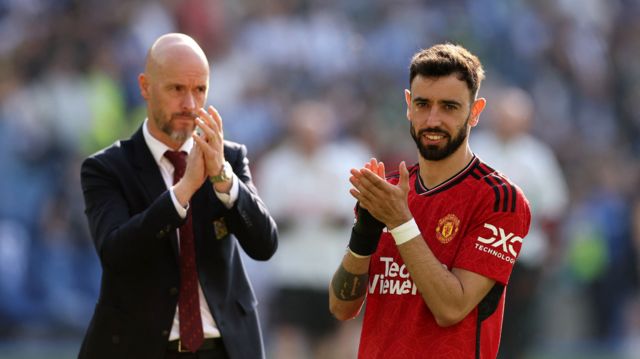 Manchester United's Bruno Fernandes and manager Erik ten Hag applaud fans after the match