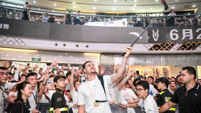 NBA player Klay Thompson of the Golden State Warriors shoot a selfie in a fans meeting on June 26, 2018 in Zhengzhou, China.