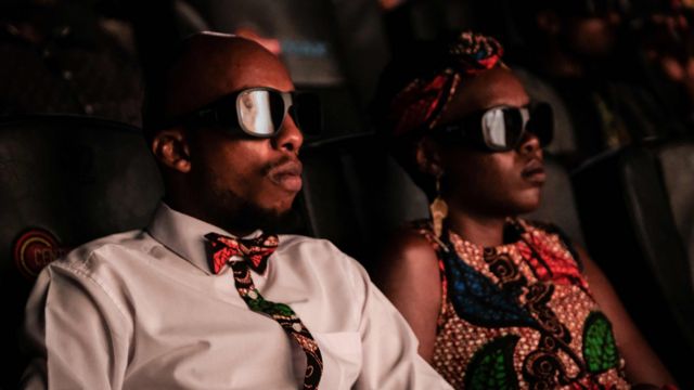 Invited guests watch the film "Black Panther" in 3D in Nairobi, Kenya, on February 14, 2018