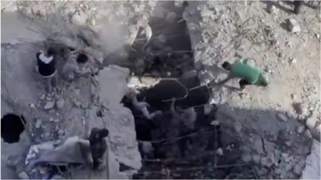 People sift through rubble in Gaza