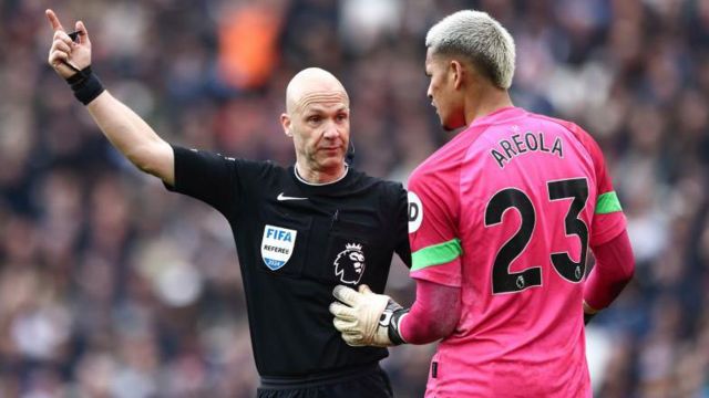 Match referee Anthony Taylor is officiating the Premier League match between West Ham United and Liverpool at the London Stadium