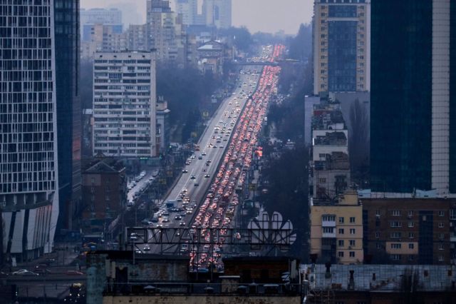 Cars block the road as residents try to flee Kiev.