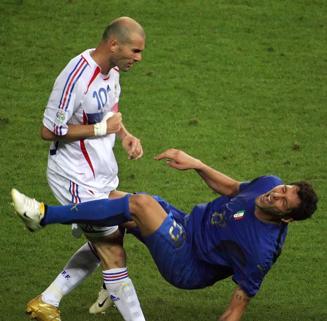 French midfielder Zinedine Zidane (L) gestures after head butting Italian defender Marco Materazzi during the World Cup 2006 final football match between Italy and France at Berlin's Olympic Stadium, 09 July 2006.