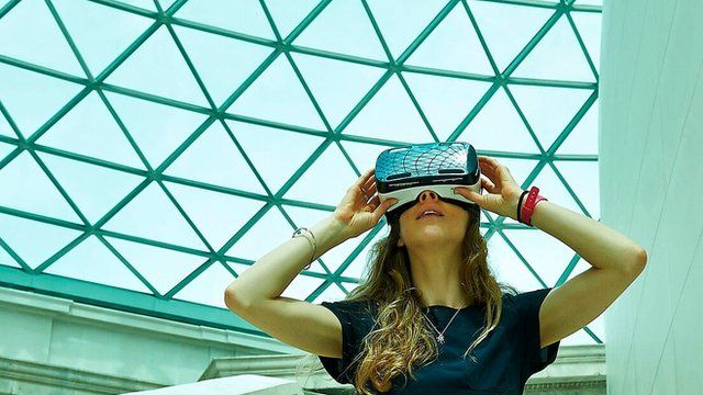 Woman in British Museum wearing VR headset