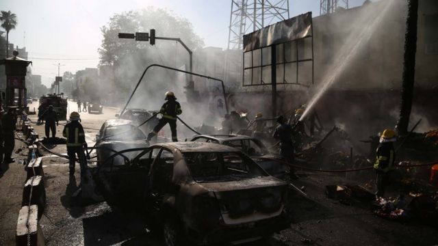 Afghan police inspect the site of a blast in Jalalabad, Afghanistan, July 1, 2018