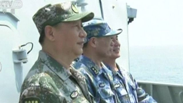 Chinese leader Xi Jiping inspects troops at a undisclosed location in the South China Sea