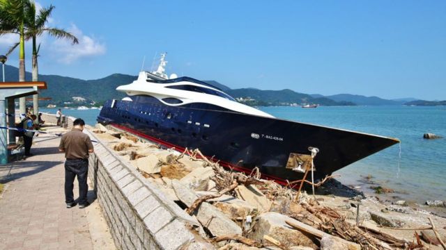 A superyacht is washed ashore by a storm near Hong Kong