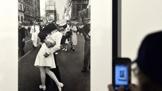 A visitor takes a snapshot of VJ Day in Times Square, New York, 1945" by Alfred Eisenstaedt in Rome on April 30, 2013
