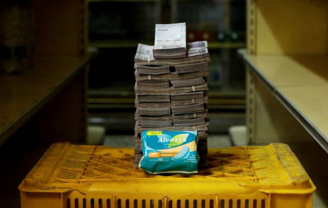 A packet of sanitary pads next to 3,500,000 bolivars