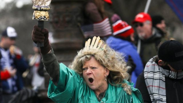 Leigh Ann Luck dressed up as the Statue of Liberty shouts as supporters of President Donald Trump gather near the Capitol building in Washington