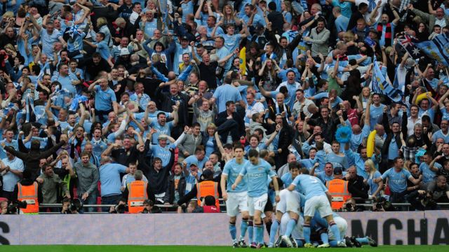 Manchester City players and fans celebrate Yaya Toure goal in FA Cup semi-final