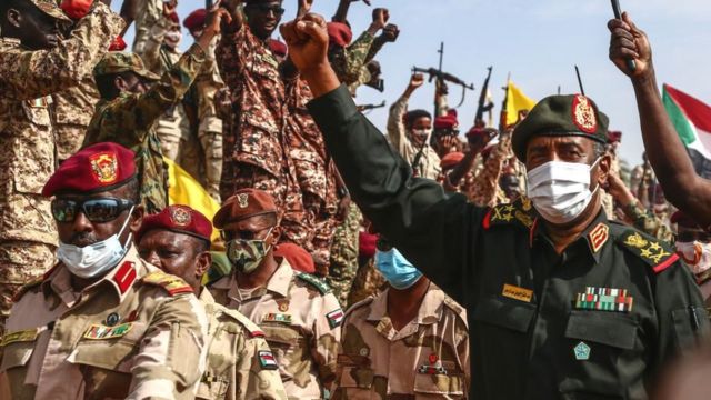 Sudan's Gen Burhan (R) visiting an air base in Omdurman in August 2020