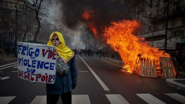 Paris witnessed clashes between the police and masked men who smashed shop windows and burned street contents