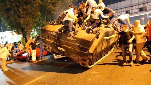 People occupy a tank in Istanbul