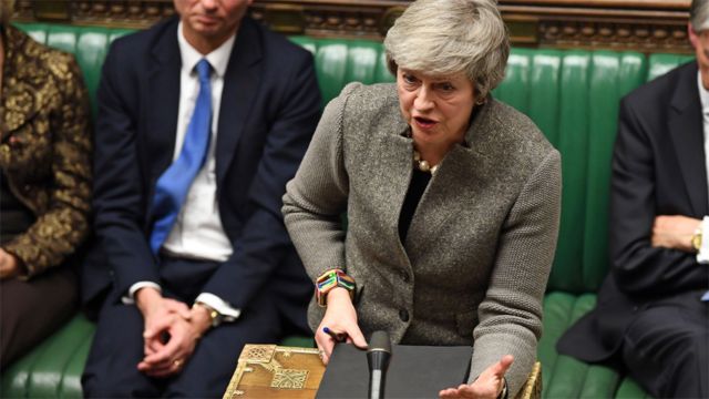 Theresa May gestures at the dispatch box