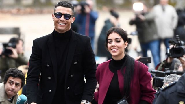 Juventus' forward and former Real Madrid player Cristiano Ronaldo arrives with his Spanish girlfriend Georgina Rodriguez to attend a court hearing