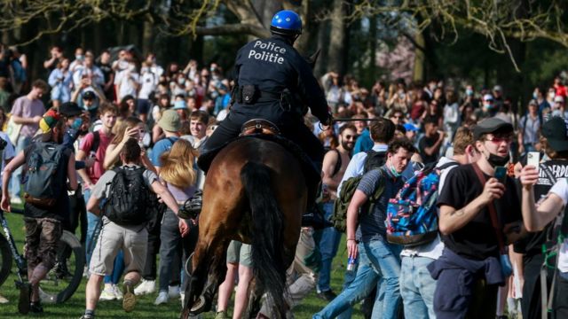 Police on horses try to disperse people as they take part in fake festival called "La Boum" organized by an anonymous group of people on Facebook for an April Fool"s joke at the "Bois de la Cambre, in Brussels, Belgium, 01 April 2021.