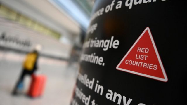 Airport sign warning about red list countries